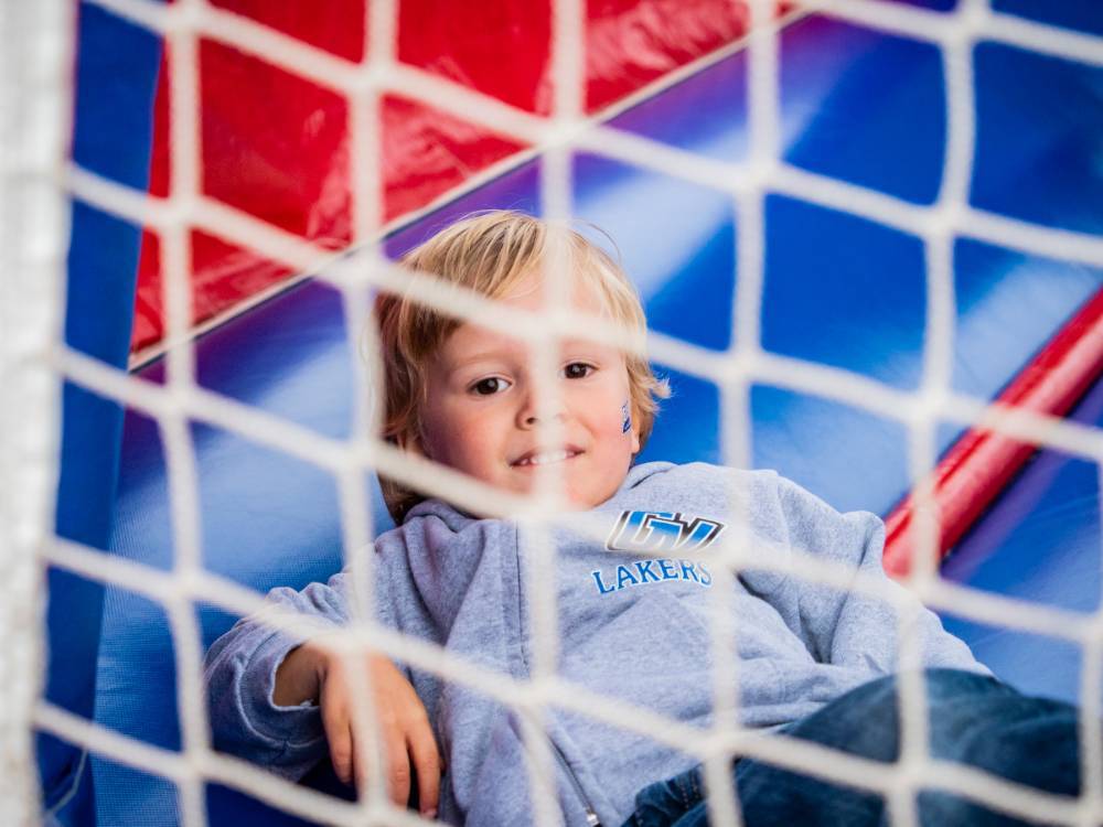 Little Laker plays in bouncy house